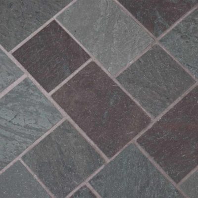 Pattern of brown, grey, and green tiles.
