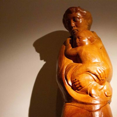 A statue of a mother holding a child.