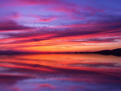 Red and purple sunset over water.